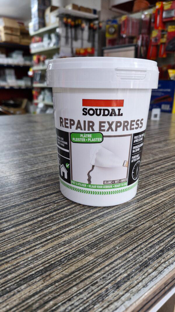 900ml tub of Soudal Repair Express Plaster on workshop shelf ready for trade wall patching