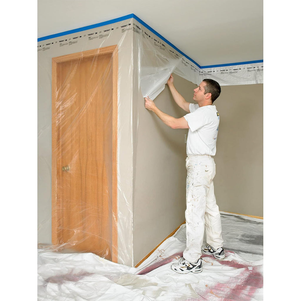 Applying 3M contractor's plastic near ceiling for full wall protection