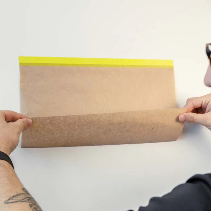 Applying iQuip Envo pretaped kraft paper refill to protect wall surface from paint