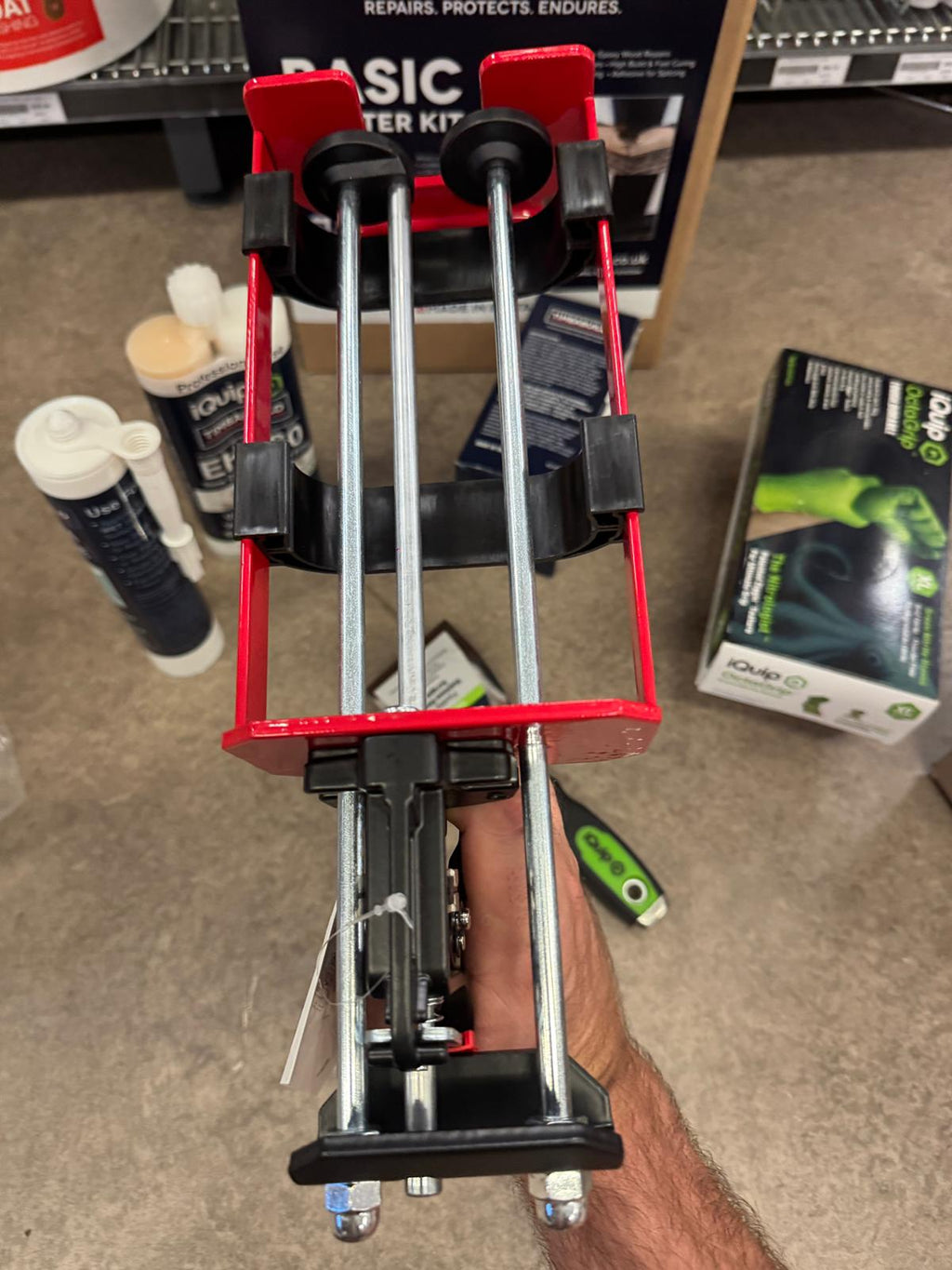 Professional Timbabuild epoxy extrusion tool showing 2:1 ratio dosing mechanism