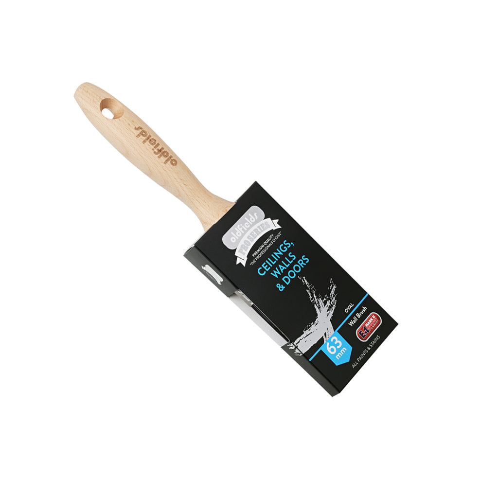 Angled view of Oldfields Pro Series 63mm oval wall brush in packaging for painting