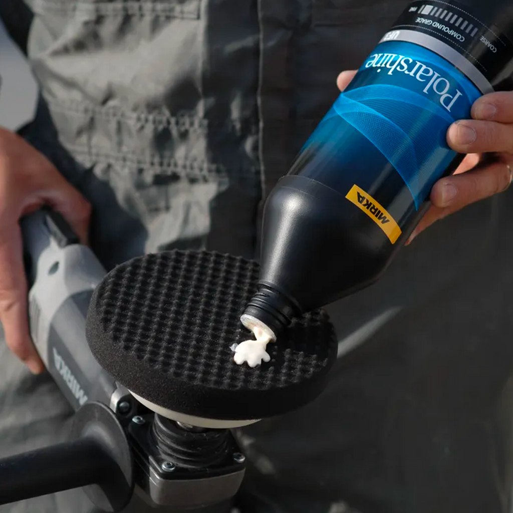 Tradie applying Mirka Polarshine finishing compound to a 150mm black waffle foam pad