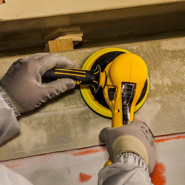 Tradie using a Mirka ROS2 610CV two-handed sander on a large surface for rapid material removal
