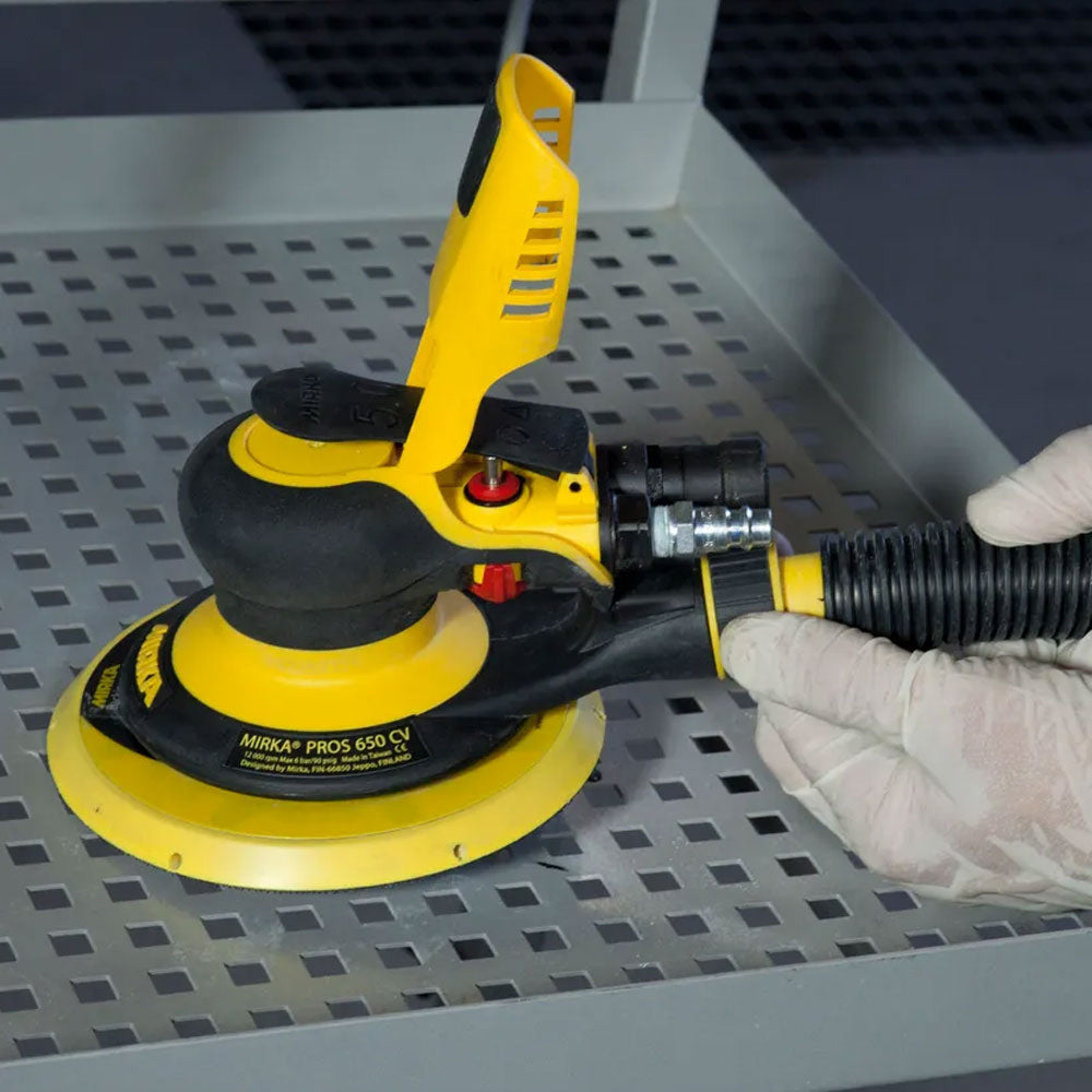 Close-up of the central vacuum connection on the Mirka PROS 650CV for dust-free operation