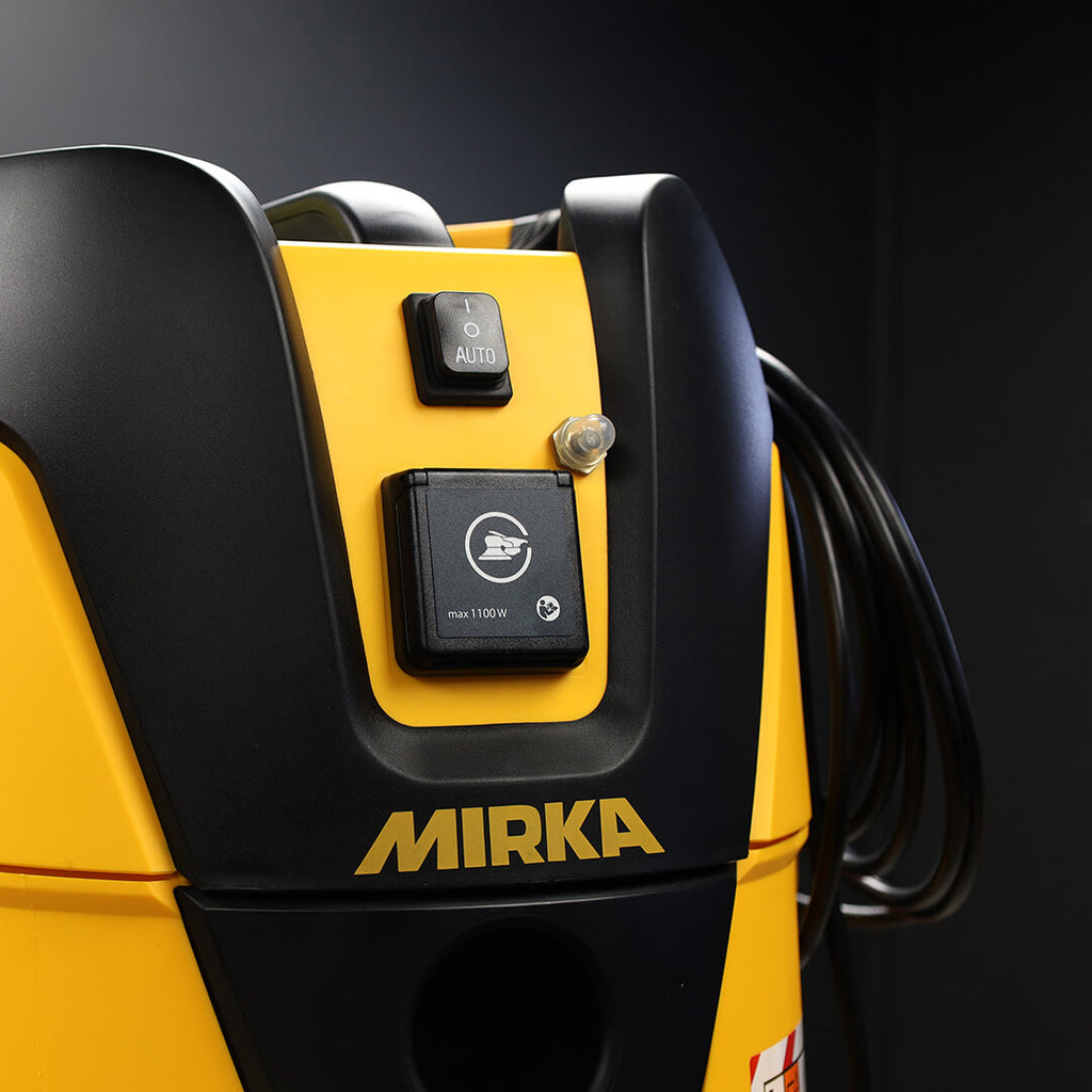Detailed view of Mirka 1125L PC control panel with AutoStart switch and power outlet